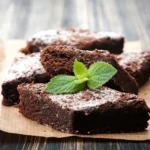 A stack of rich, fudgy brownies cut into neat squares.
